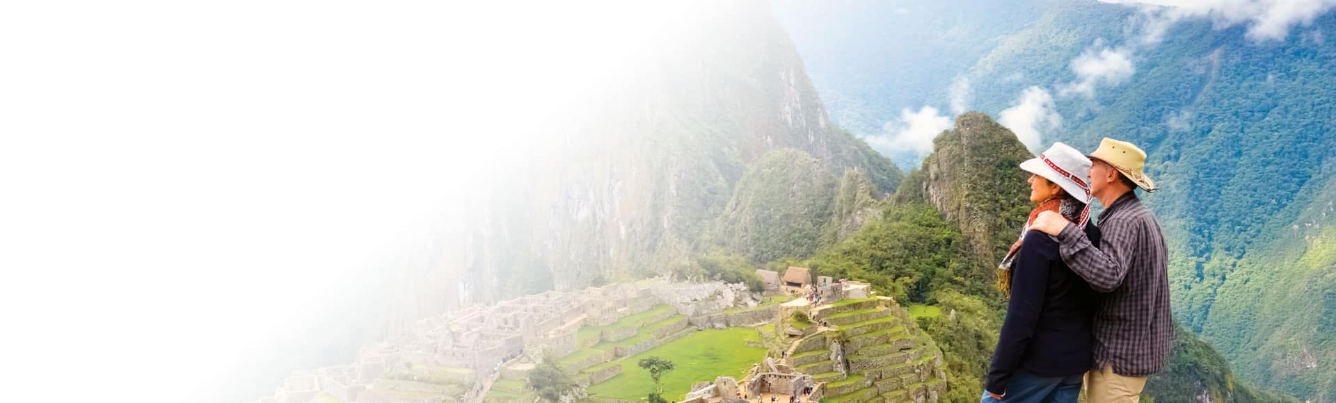 Couple ovelooking Machu Picchu in Peru